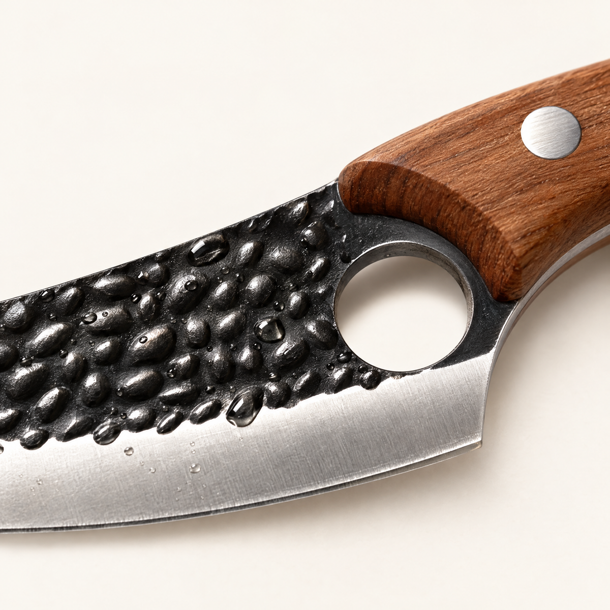 Close-up of the hammered tsuchime blade texture and finger hole